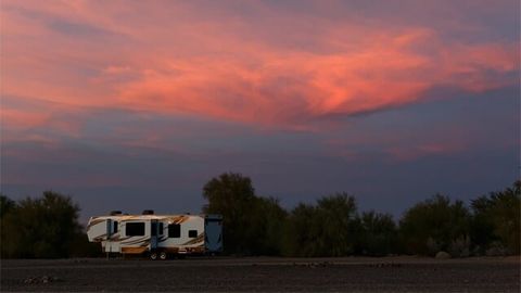 Large RV Against Sunset Clouds — RV Parking in Peroria, IL