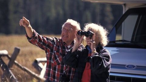 Senior Couple Looking Through Binoculars — RV Parking in Peroria, IL