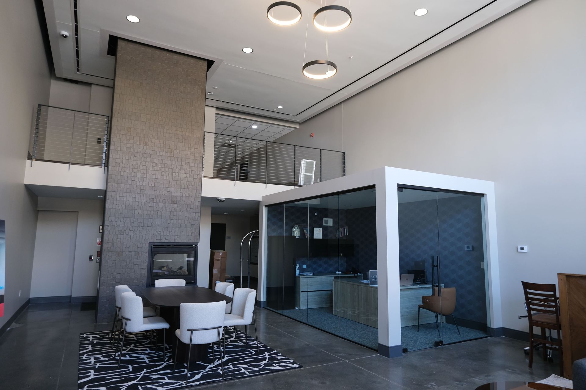 A large room with a table and chairs in it