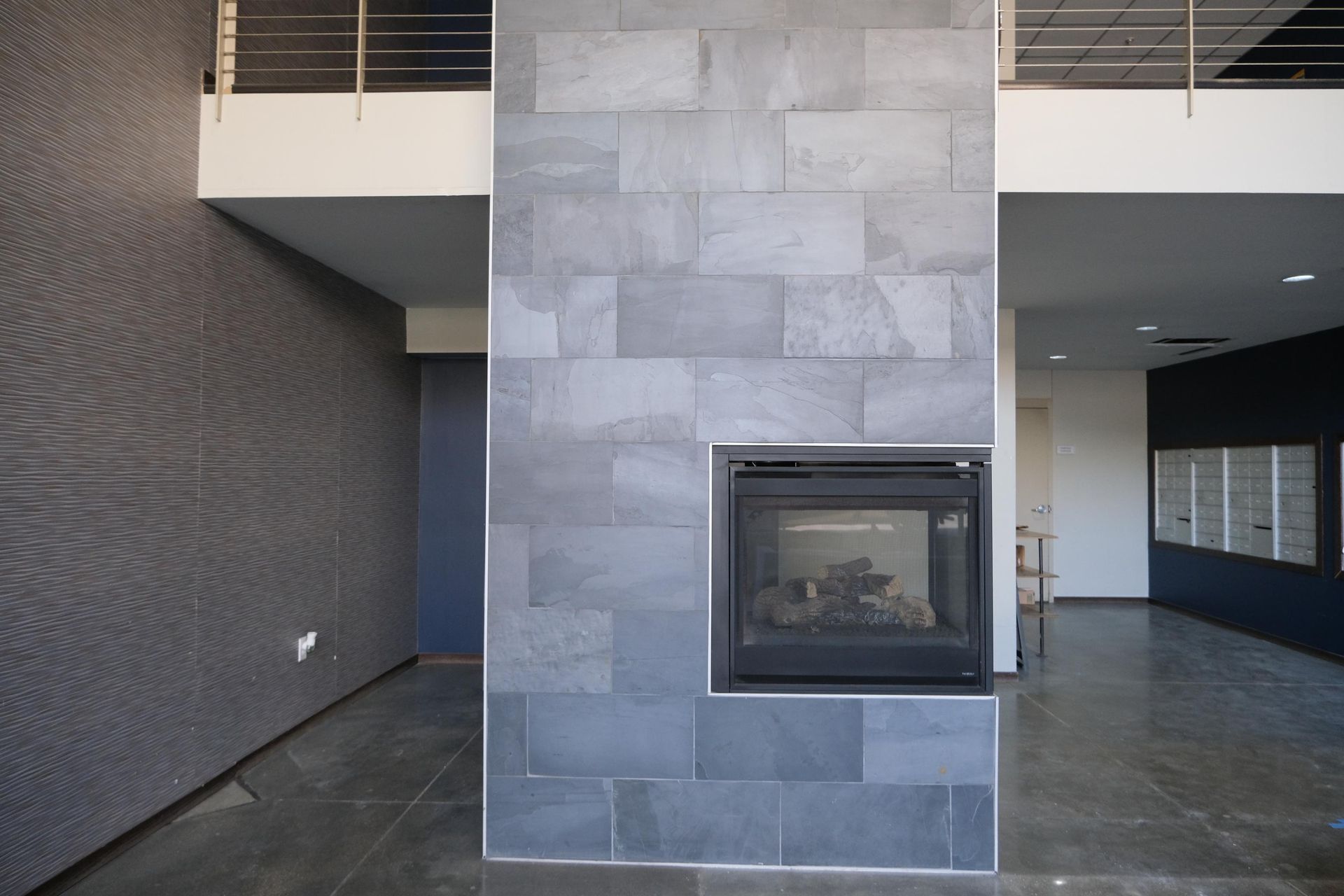 There is a fireplace in the middle of the room.