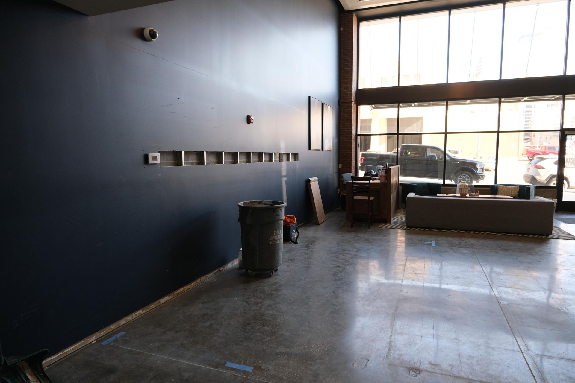 There is a trash can in the middle of the room.