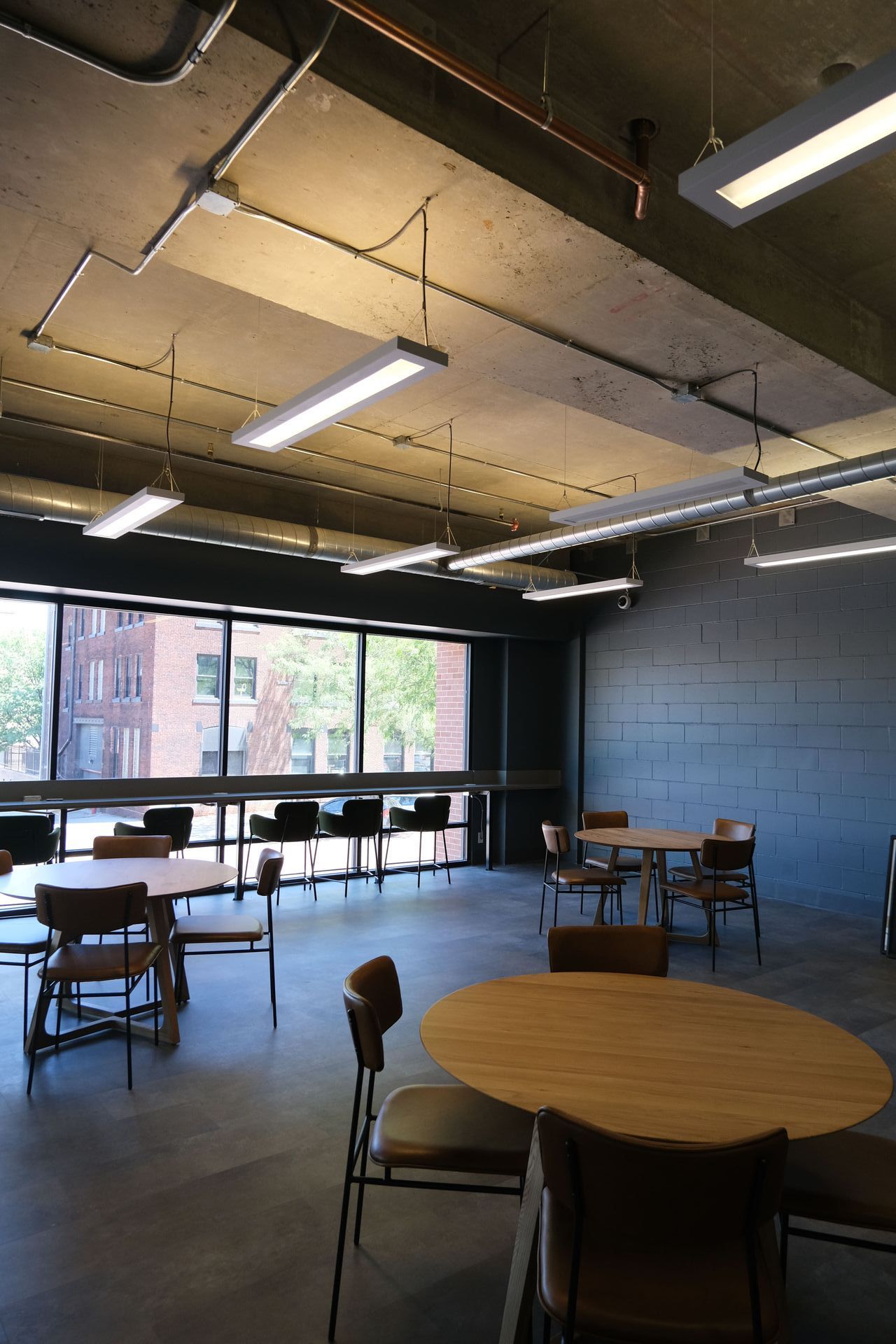 A large room with tables and chairs in it