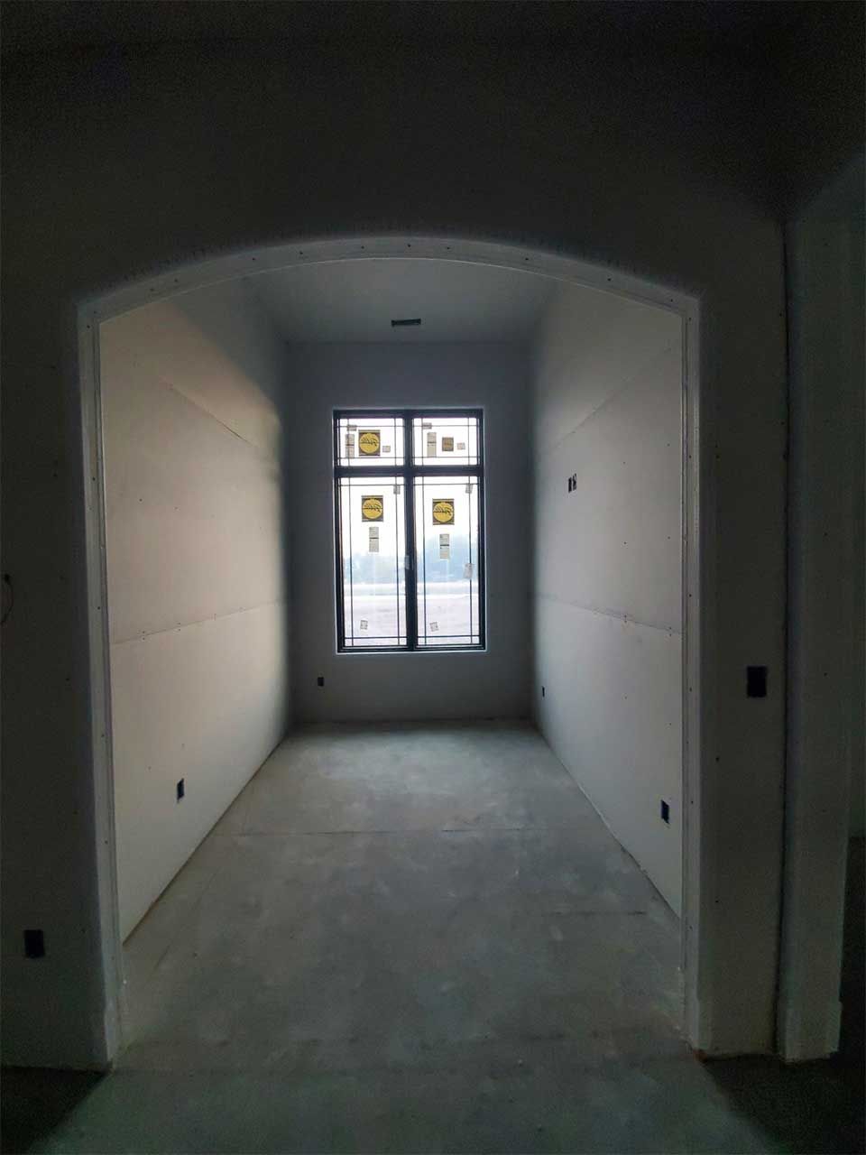 There is a large window in the middle of the room.