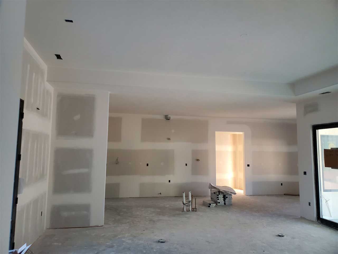 A room with a lot of drywall on the walls