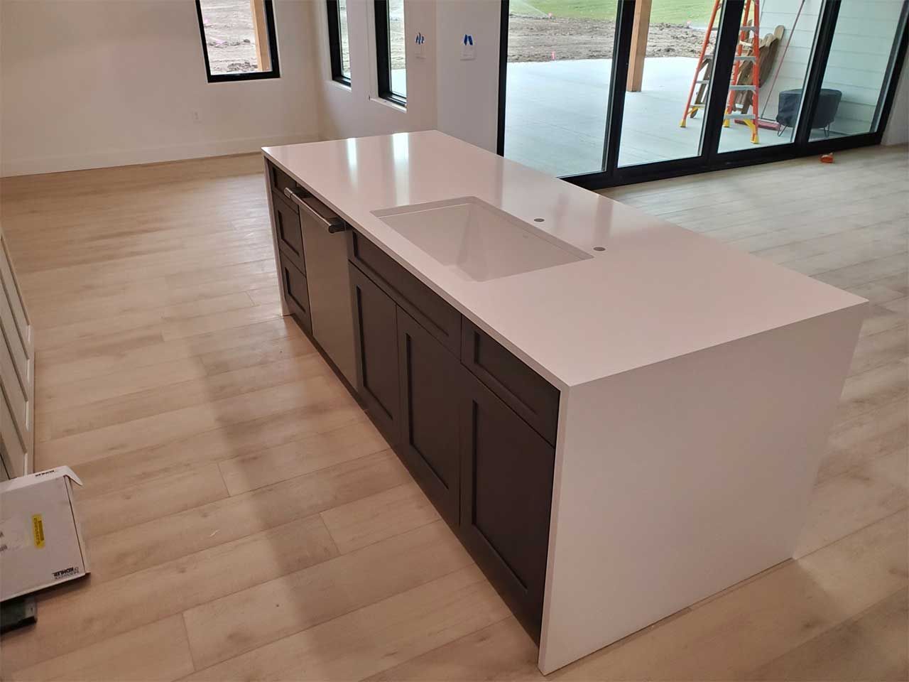 A kitchen with a large island in the middle of the room.