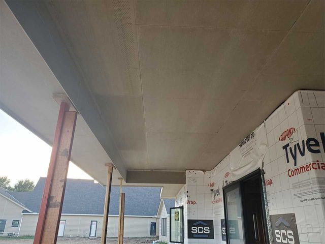 A building under construction with a sign that says sos on it.