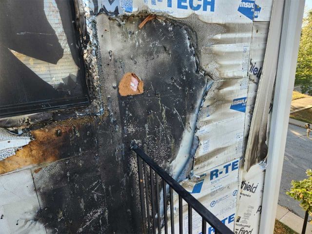 A building that has been damaged by a fire and has the word tech on it