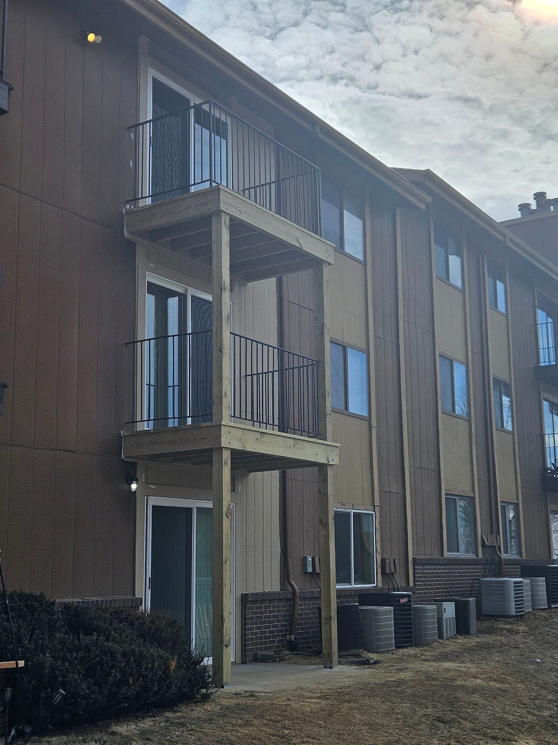 A large apartment building with a lot of windows and balconies