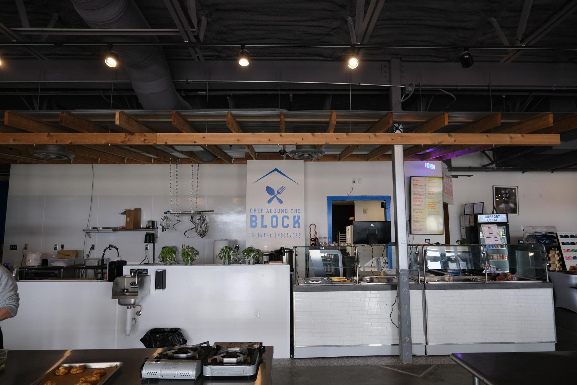 Interior view of a casual eatery counter with a blue 