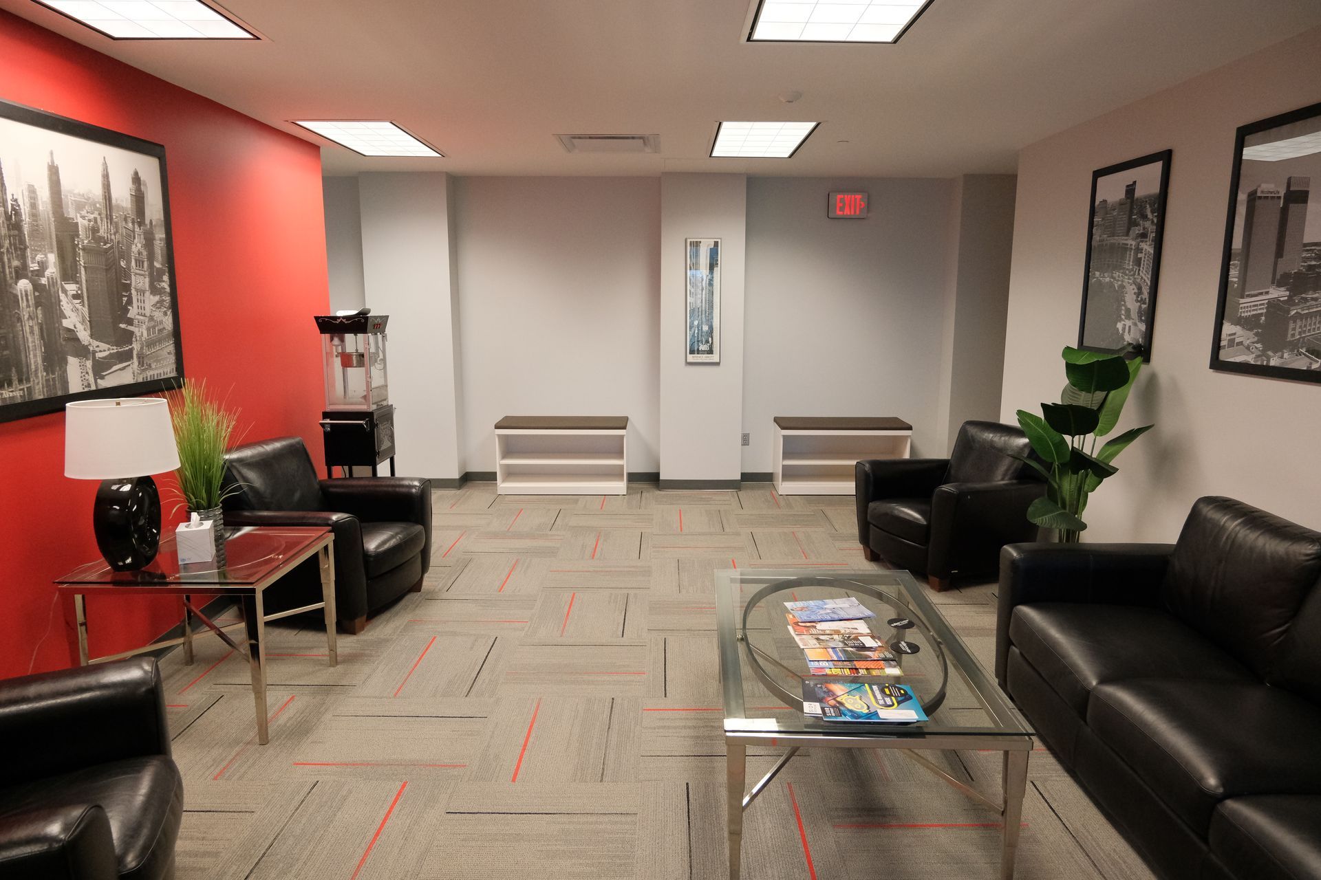 A living room with a couch , chairs and a coffee table