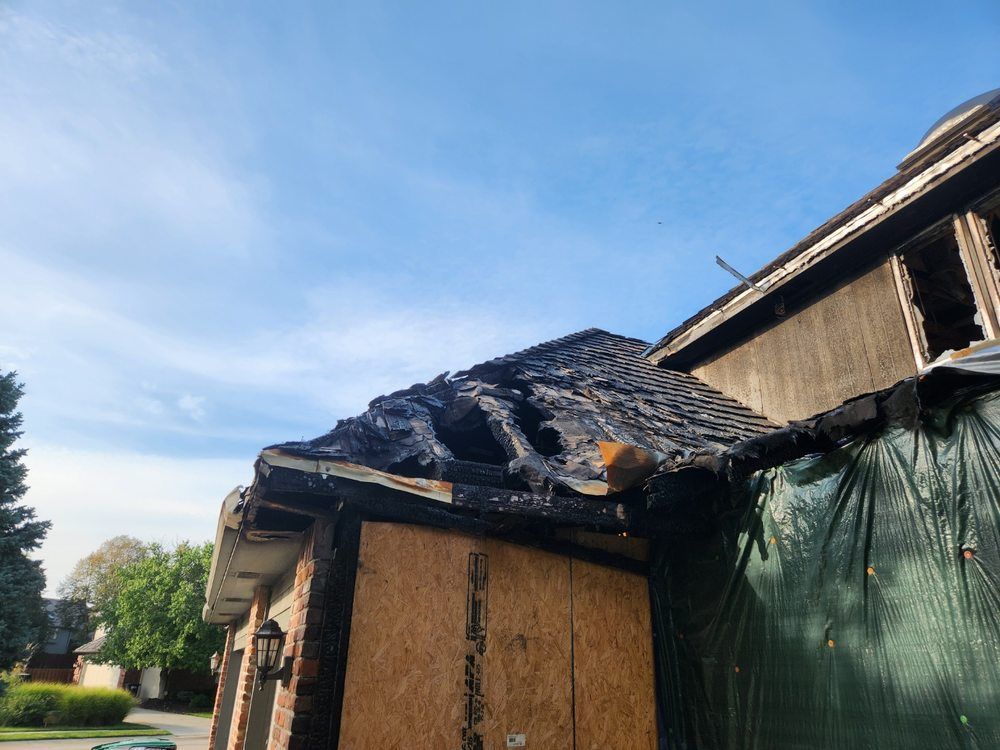 A roof of a building that has been damaged by a fire