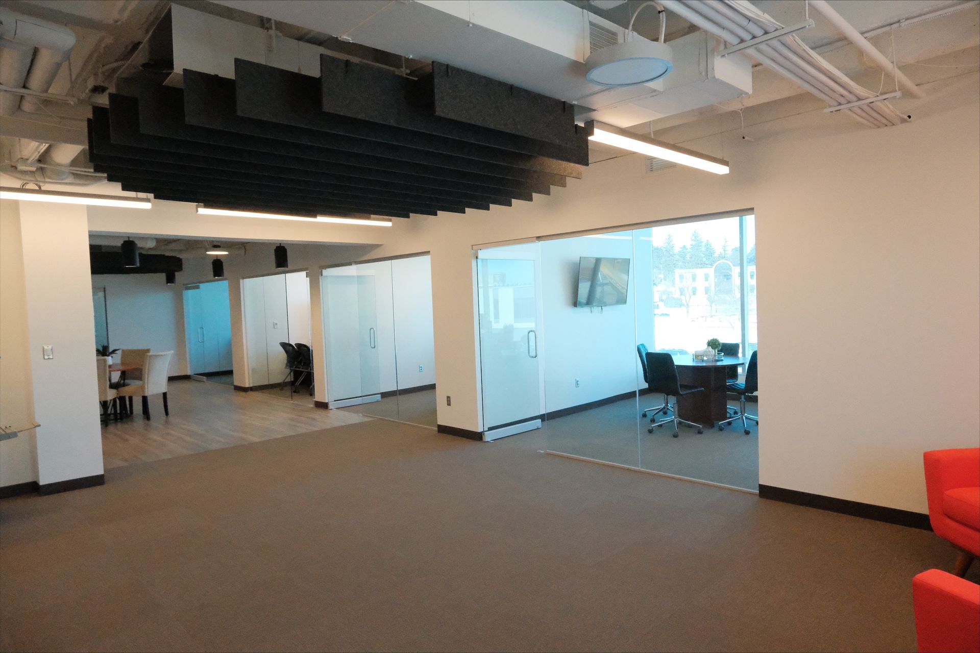 A large room with a lot of windows and chairs