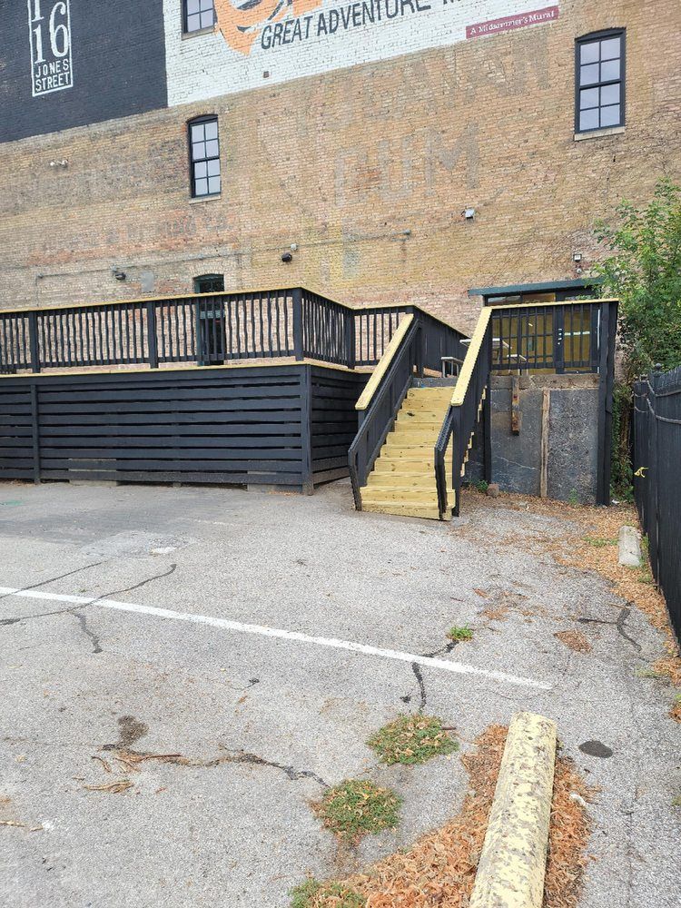 A brick building with stairs leading up to it