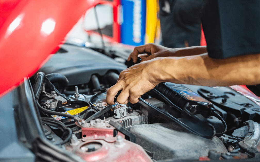 a mechanic under hood of a car in Sanford, FL