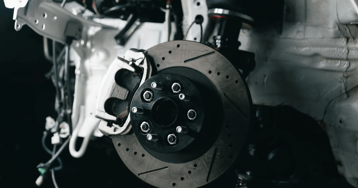 two mechanics performing routine car maintenance