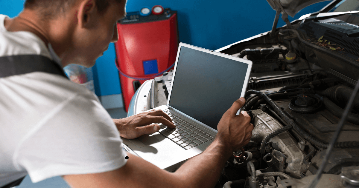 a mechanics doing an engine diagnostic