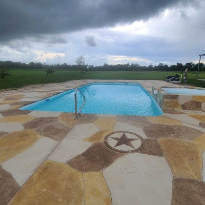 A large swimming pool with a star in the middle