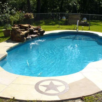 A large swimming pool with a star in the middle