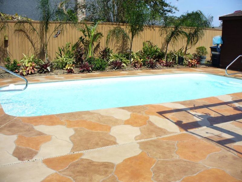 A large swimming pool with a fence surrounding it