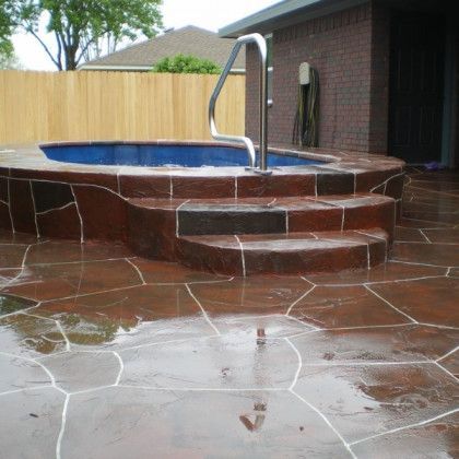 A swimming pool with stairs leading up to it