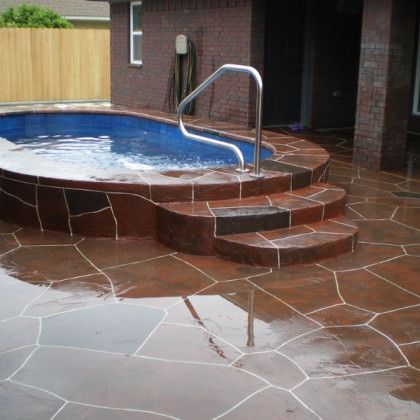 A swimming pool with stairs leading up to it
