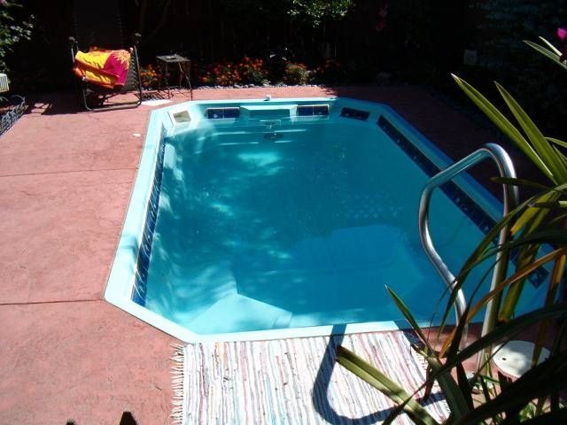A swimming pool with a staircase leading to it