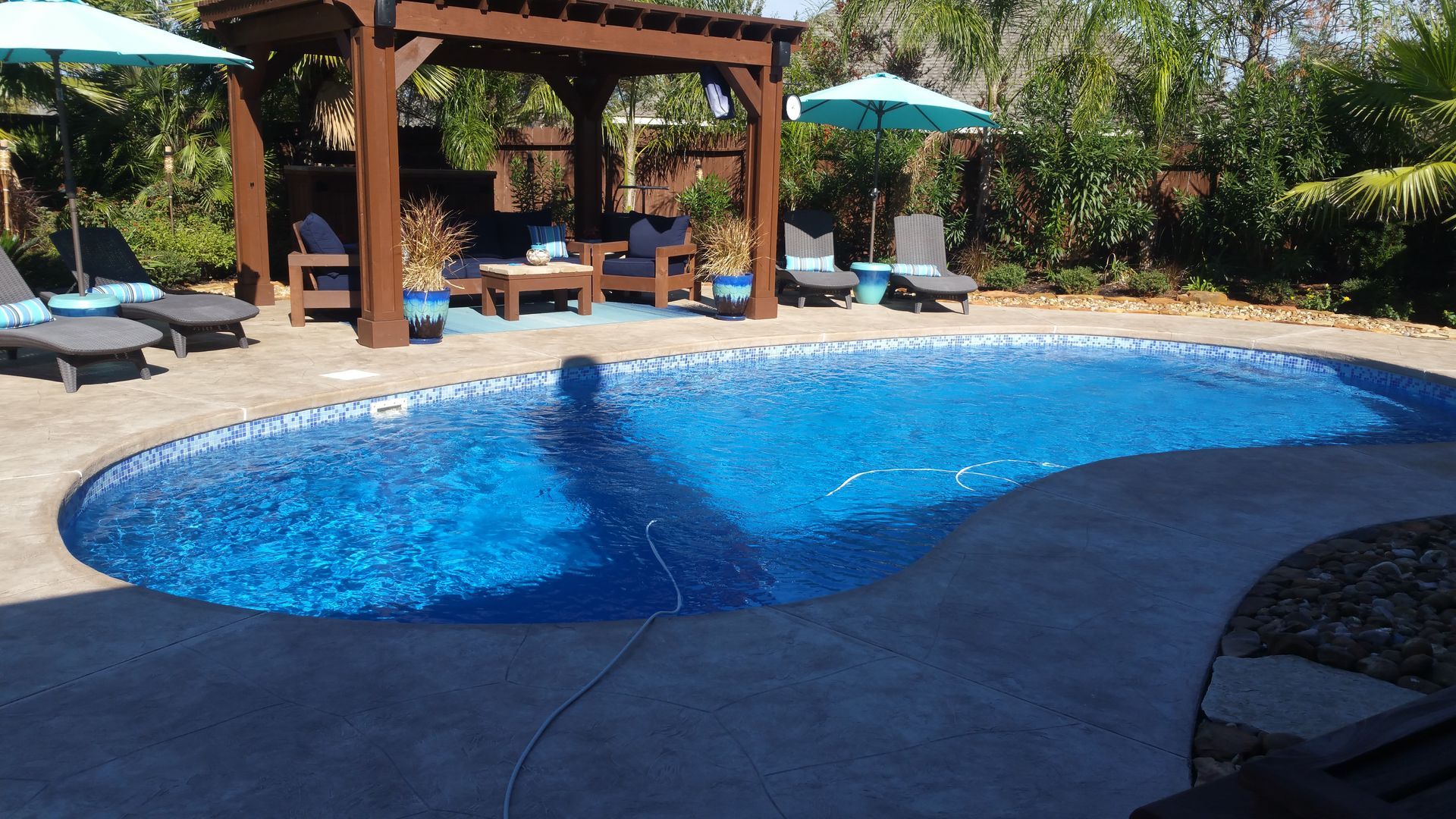 A large swimming pool with a basketball court in the middle