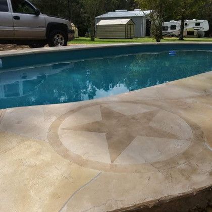 A truck is parked next to a swimming pool.