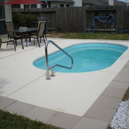 A swimming pool with a staircase leading to it