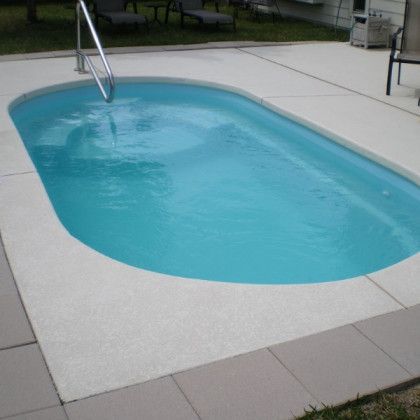 A large swimming pool with a staircase leading to it