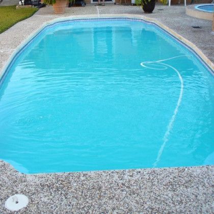 A large swimming pool filled with blue water