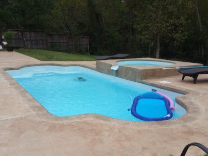 A large swimming pool with a raft in it