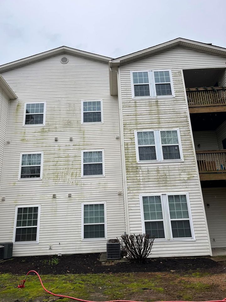 white apartment building before being pressure washed