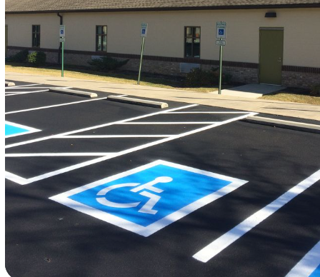 A handicapped parking spot in a parking lot