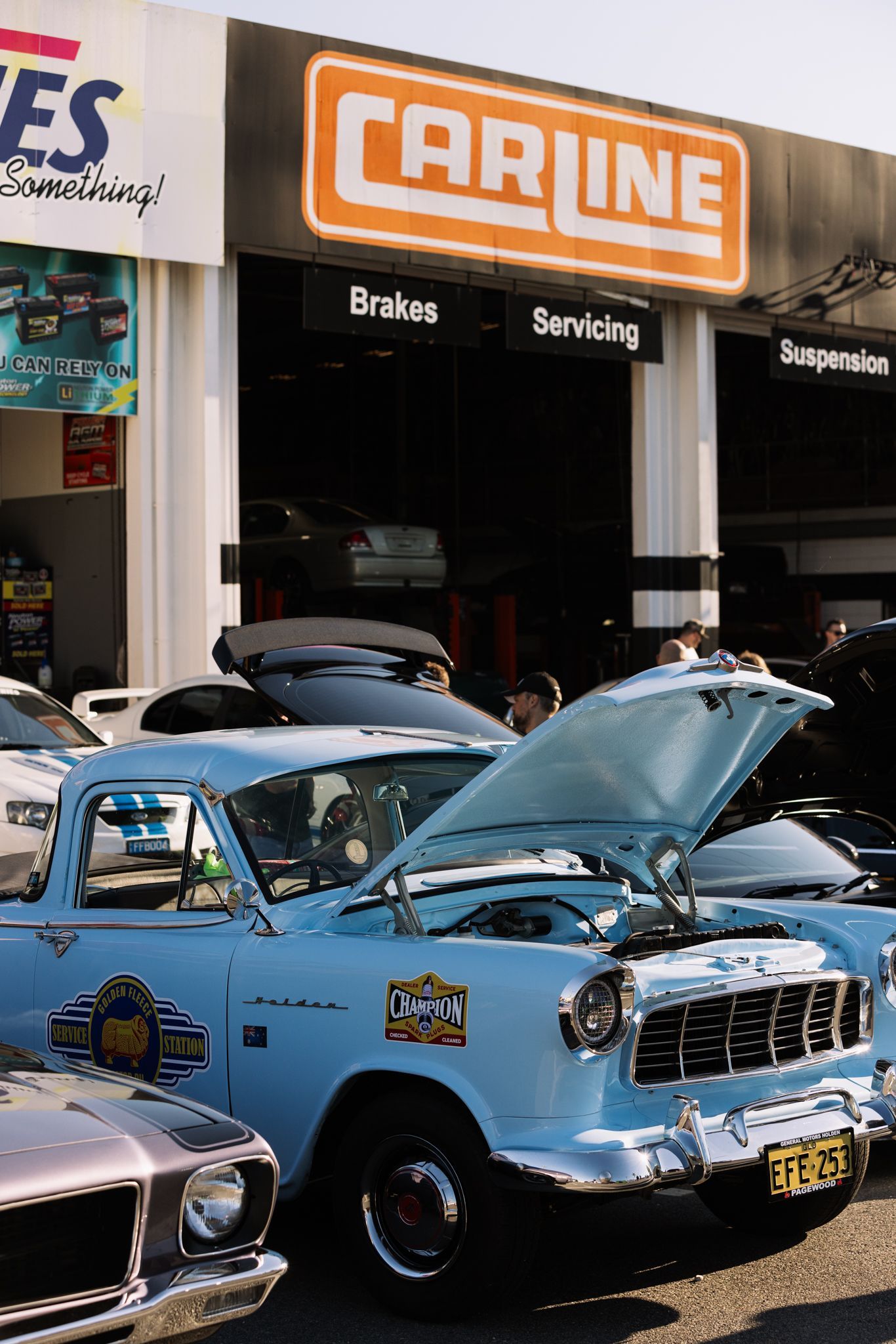 An Oldskool Hot Rod Haulage Truck Is Carrying a Car — Carline Automotive Solutions in Bungalow, QLD