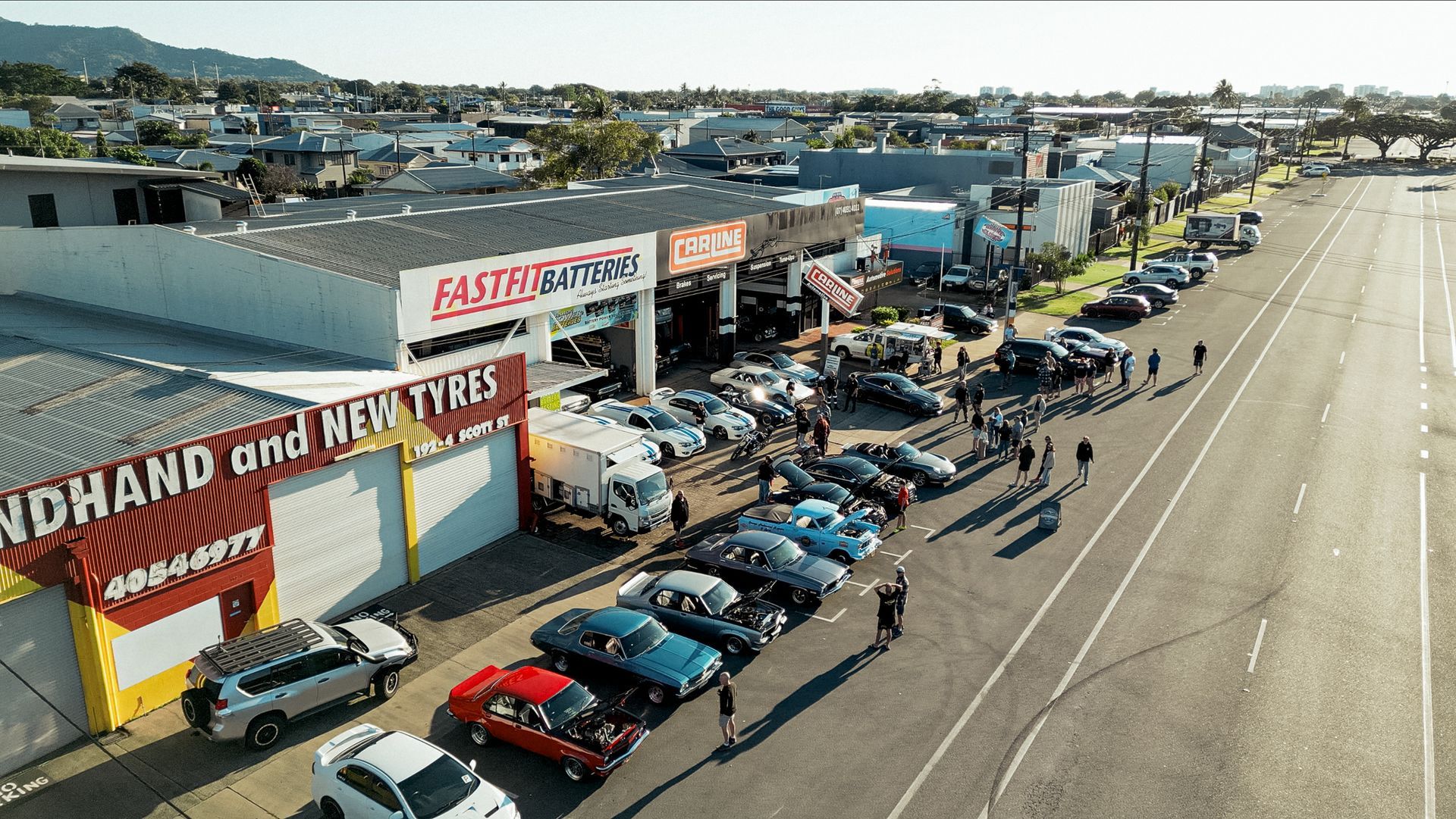 A Car Is Sitting on A Lift in A Garage — Carline Automotive Solutions in Bungalow, QLD