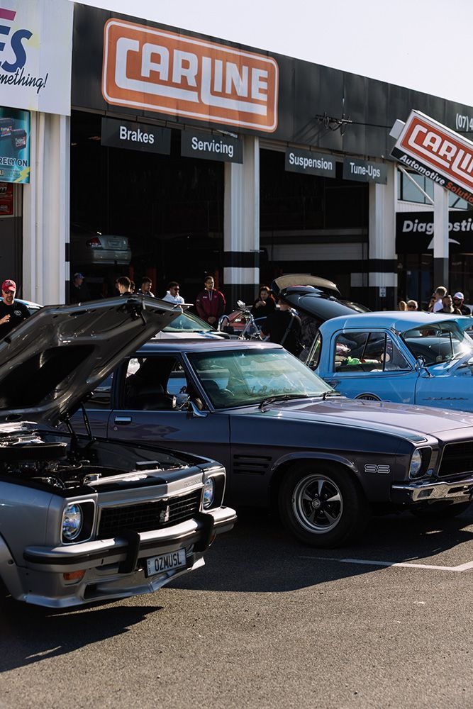 Classic Cars on Display in Front of a Carline Auto Parts Store — Carline Automotive Solutions in Bungalow, QLD