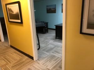 Seamless carpet tile flooring continues through commercial office rooms in Plantation, FL.