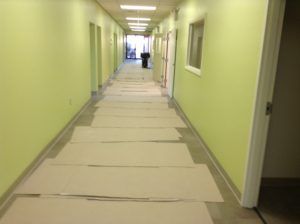 Commercial hallway in Plantation, FL protected for upcoming carpet or vinyl flooring installation.