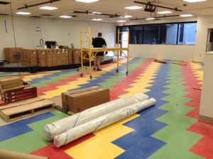 Colorful commercial vinyl tile installation in progress by professional flooring installers in Plantation, FL.