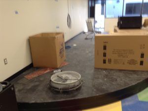 Commercial stage surface prepped for new flooring installation by contractors in Plantation, FL.