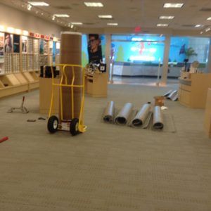 Carpet rolls and tools ready for installation in a Plantation, FL commercial flooring project.