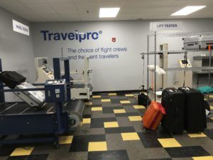 A room with luggage and a sign that says travelpro