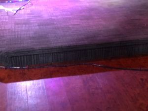 Stage area with commercial carpet installation and wood flooring in Plantation, FL event venue.