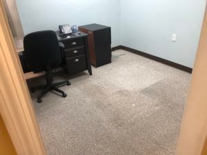 Office space with carpet flooring installation in progress by Plantation, FL flooring contractors.
