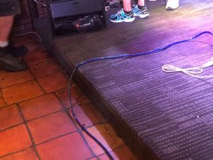 Custom carpet work on stage area with tile flooring in a commercial venue in Plantation, FL.