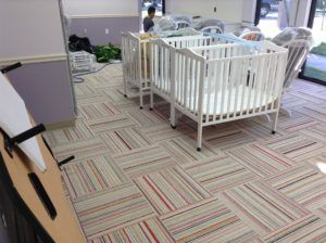 Colorful carpet tile flooring installed in a daycare center in Plantation, FL for commercial use.