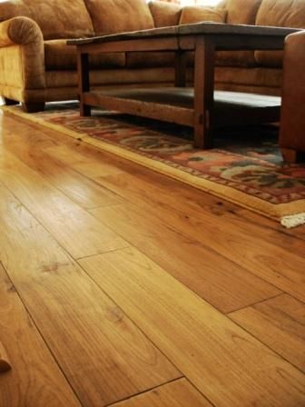 A living room with hardwood floors and a coffee table
