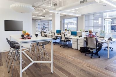 A man is sitting at a desk in an office.