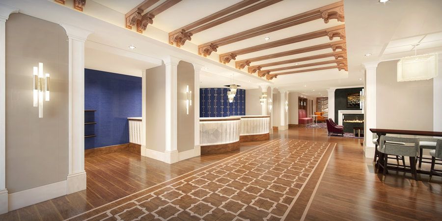 An artist 's impression of the lobby of a hotel.